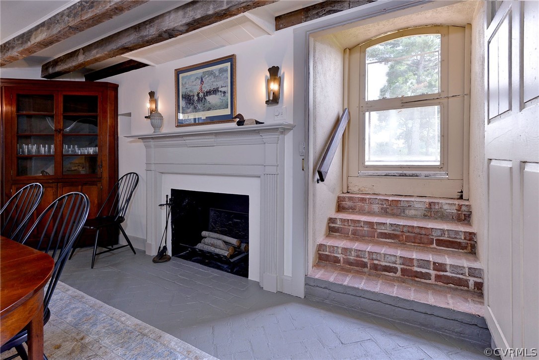 2459 Dunbrooke Road Tappahannock, VA 22560 - Photo 24 of 49 a living room with furniture and a fireplace