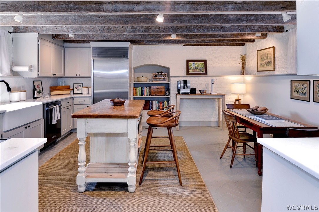 2459 Dunbrooke Road Tappahannock, VA 22560 - Photo 25 of 49 a kitchen with stainless steel appliances wooden floor stove top oven and cabinets