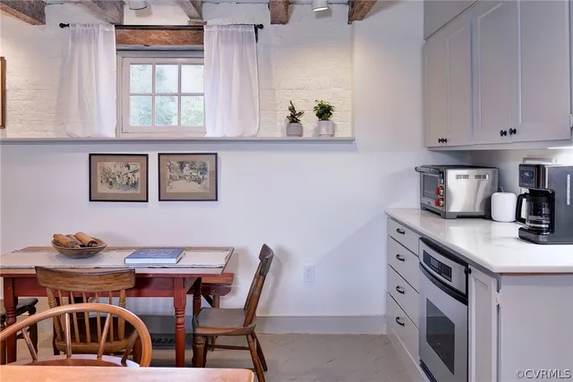 a kitchen with stainless steel appliances granite countertop a sink and cabinets