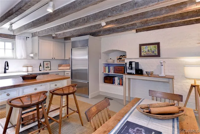 a kitchen with a sink a stove and cabinets