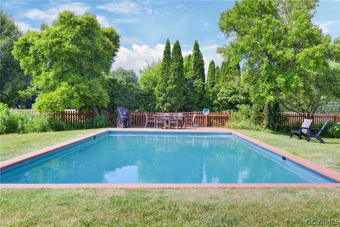2459 Dunbrooke Road Tappahannock, VA 22560 - Photo 3 of 49 a view of a swimming pool with a yard