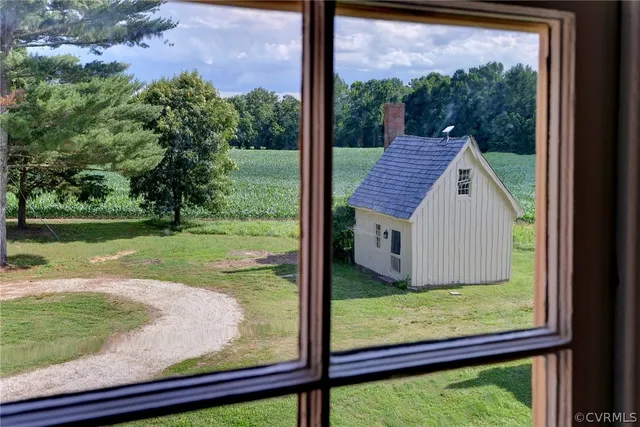 a view of a house with a backyard