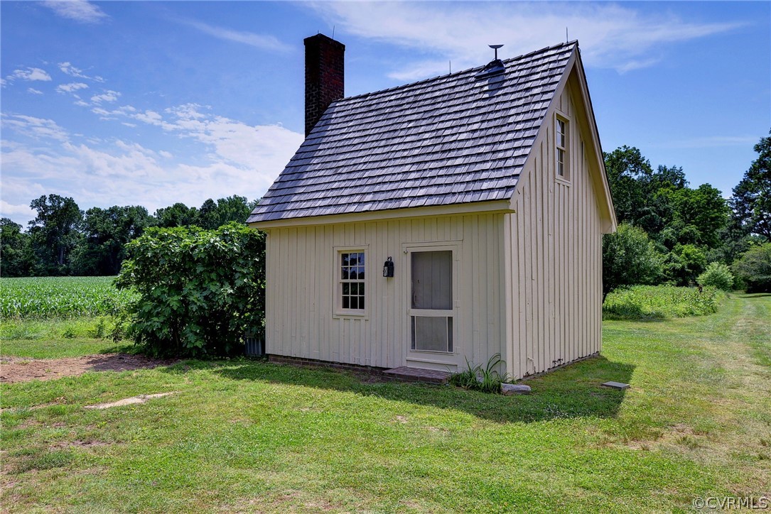 2459 Dunbrooke Road Tappahannock, VA 22560 - Photo 40 of 49 a view of a house with a backyard