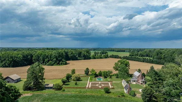 a view of a garden with a building in the background