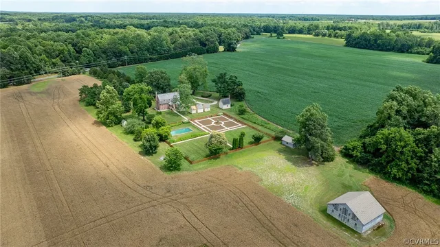 an aerial view of a house with a yard balcony