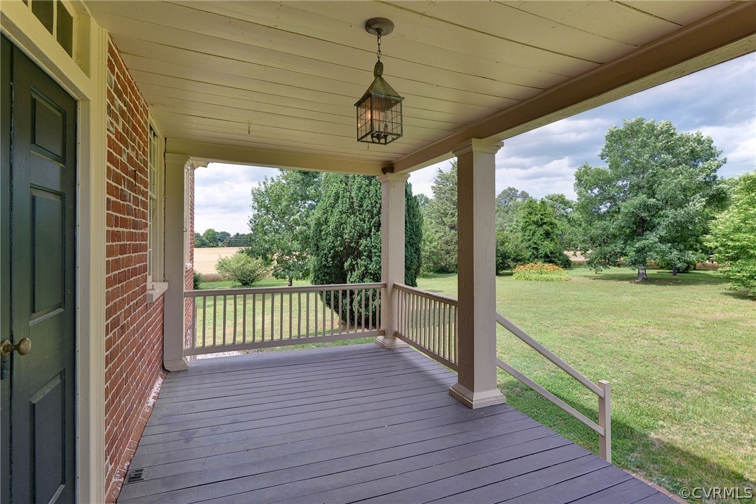 2459 Dunbrooke Road Tappahannock, VA 22560 - Photo 48 of 49 a view of a deck with wooden floor next to a yard