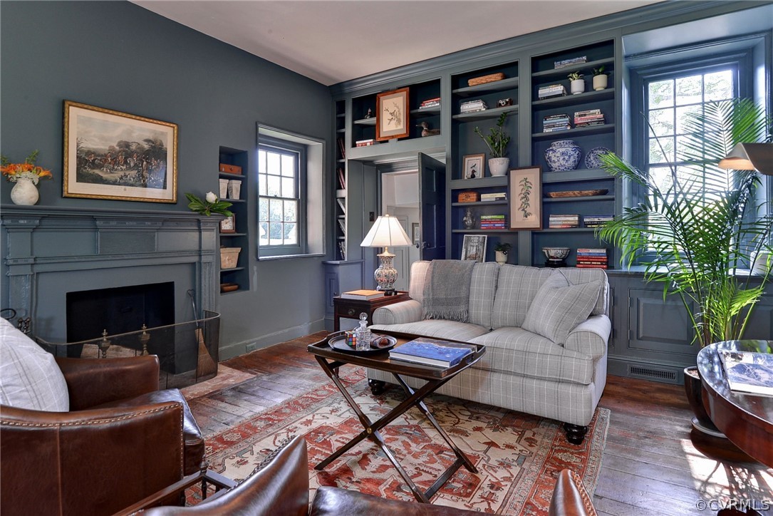 2459 Dunbrooke Road Tappahannock, VA 22560 - Photo 10 of 49 a living room with furniture a lamp and a fireplace