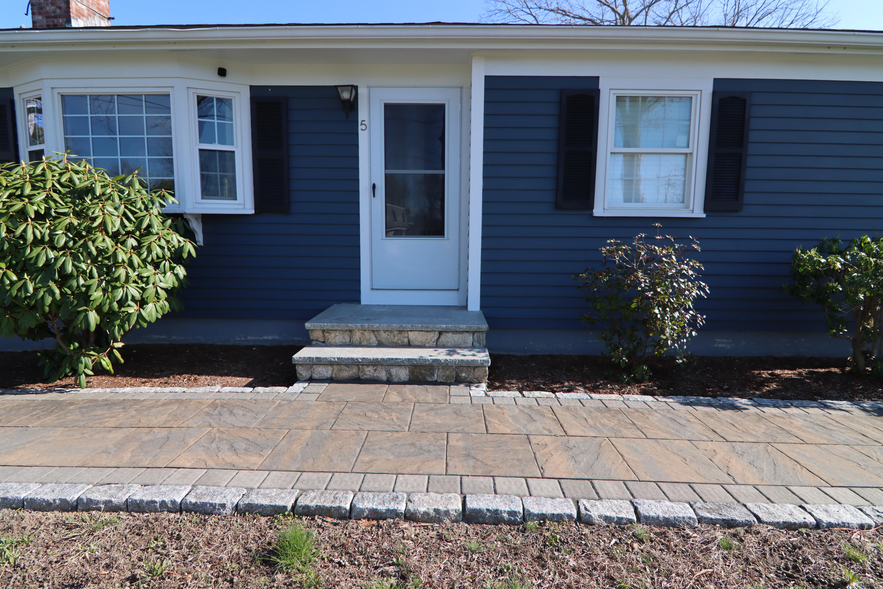 5 Alicia Road Hyannis, MA 02601 - Photo 10 of 12 a view of a house with potted plants