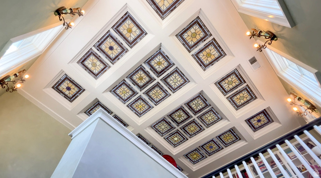 426 West Center Street Parowan, UT 84761 - Photo 42 of 107 Coffered ceiling featuring multiple decorative panels and recessed lighting, complemented by multiple wall sconces and integrated skylights