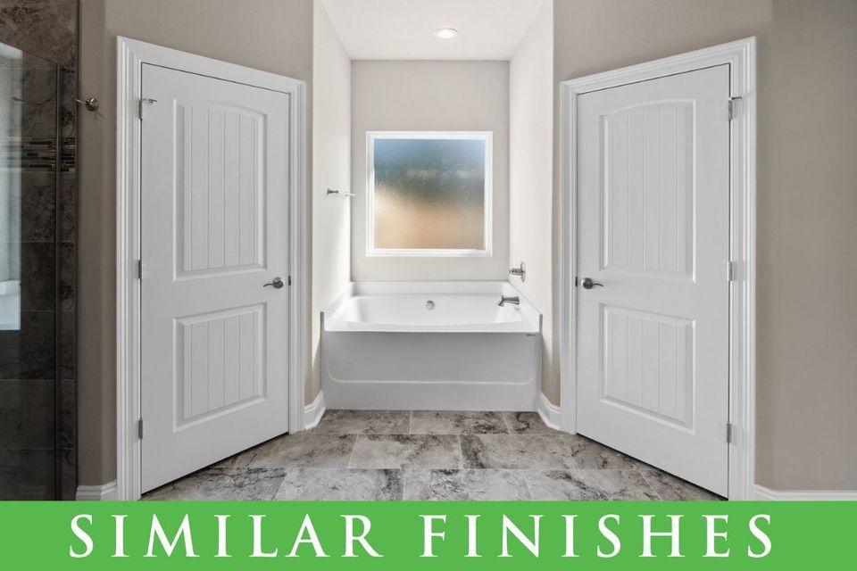 8543 Laredo Street Navarre, FL 32566 - Photo 11 of 14 a bathroom with a sink and a mirror