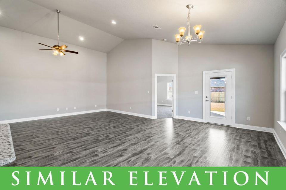 8543 Laredo Street Navarre, FL 32566 - Photo 6 of 14 a view of a room with wooden floor and window