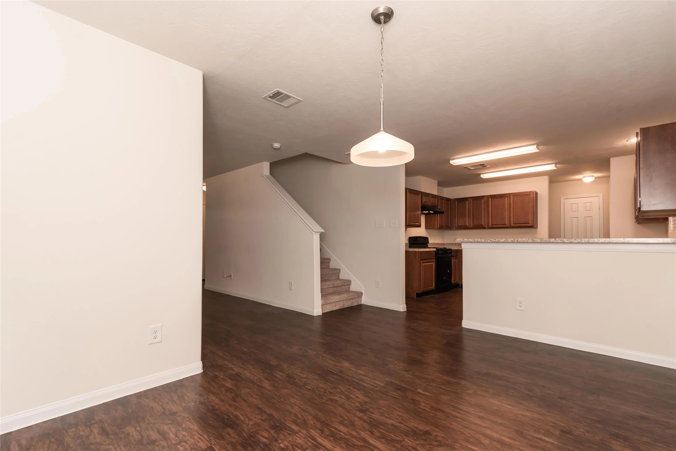21835 North Werrington Way Houston, TX 77073 - Photo 5 of 10 a view of a kitchen with a sink and dishwasher a refrigerator with wooden floor