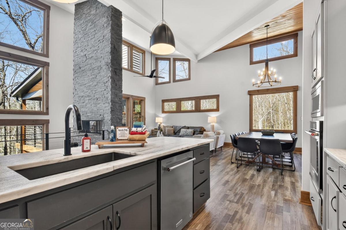 466 Watersong Bluff West Ellijay, GA 30540 - Photo 22 of 67 a kitchen with a sink appliances and a counter top space