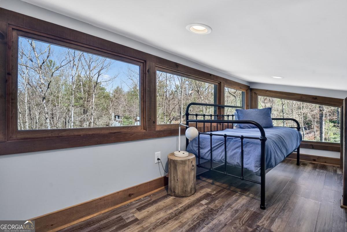 466 Watersong Bluff West Ellijay, GA 30540 - Photo 39 of 67 a bedroom with furniture and a large window