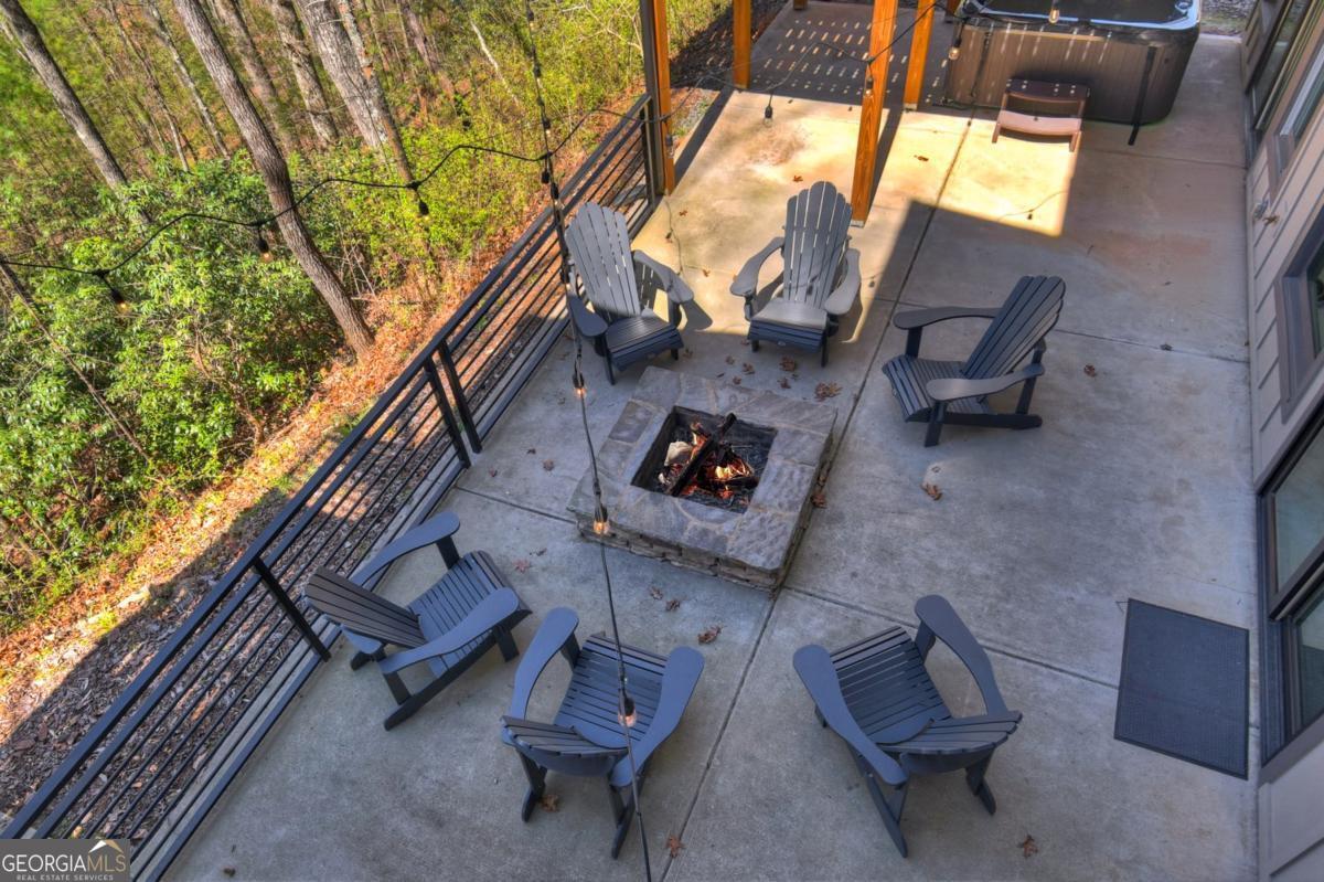 466 Watersong Bluff West Ellijay, GA 30540 - Photo 45 of 67 a backyard of a house with outdoor seating