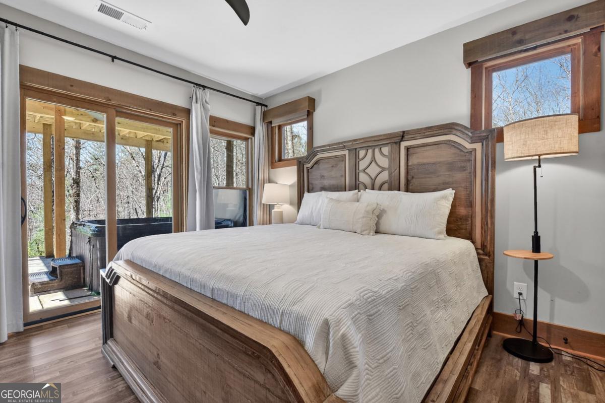 466 Watersong Bluff West Ellijay, GA 30540 - Photo 50 of 67 a bedroom with a bed and window