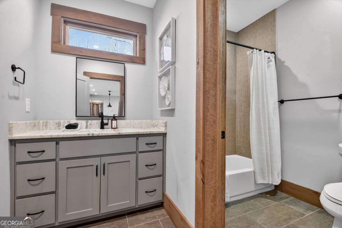 466 Watersong Bluff West Ellijay, GA 30540 - Photo 54 of 67 a bathroom with a double vanity sink mirror and toilet