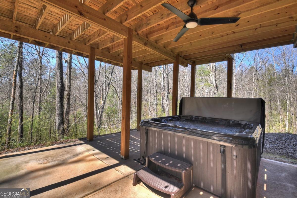466 Watersong Bluff West Ellijay, GA 30540 - Photo 63 of 67 a bedroom with furniture and large windows