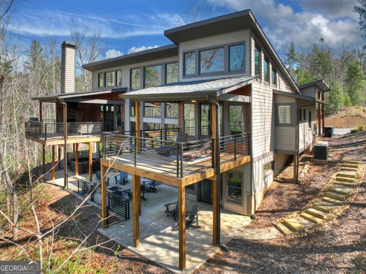 466 Watersong Bluff West Ellijay, GA 30540 - Photo 65 of 67 a front view of a house with glass windows