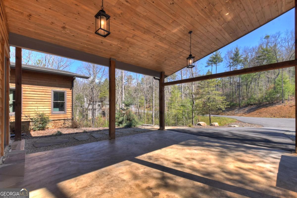466 Watersong Bluff West Ellijay, GA 30540 - Photo 10 of 67 a living room with a large window