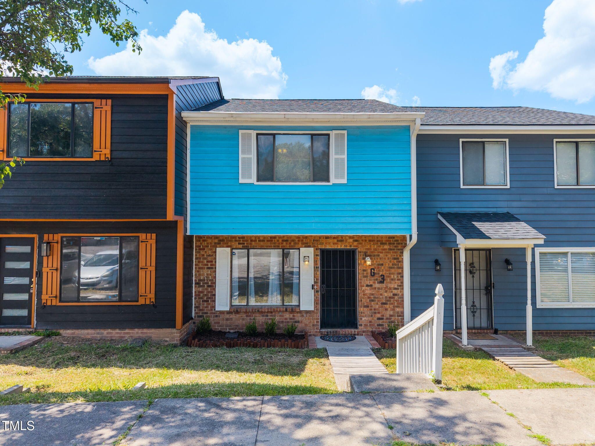a view of a house with swimming pool and sitting area