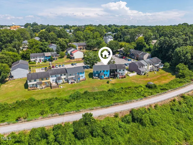 a view of a swimming pool with a yard and lake view