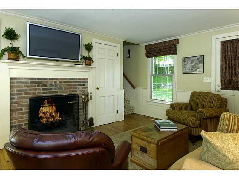 104 Old Stone Bridge Road Cos Cob, CT 06807 - Photo 9 of 12 a living room with furniture a flat screen tv and a fireplace