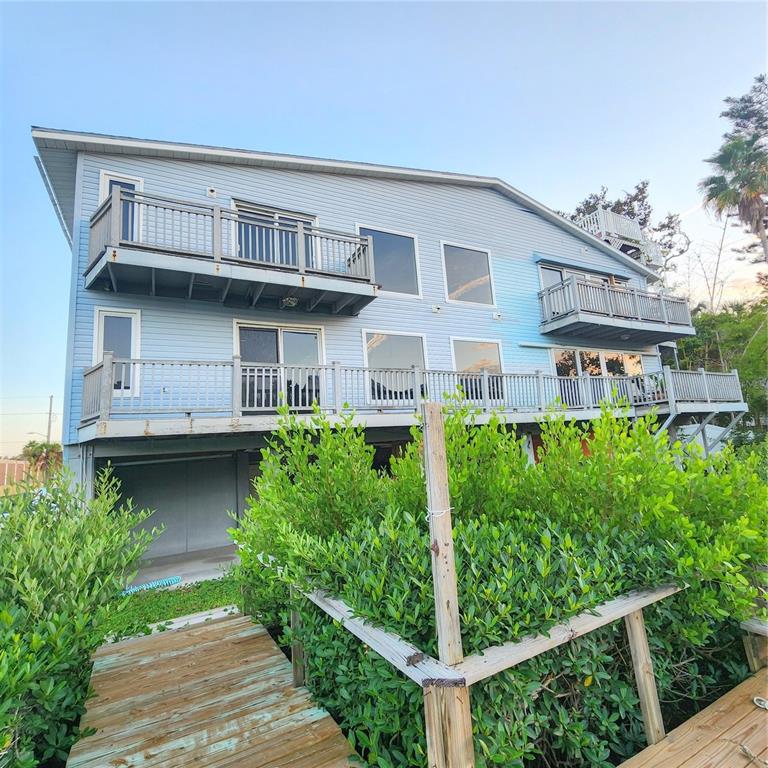 512 2nd Street, Unit 7 Indian Rocks Beach, FL 33785 - Photo 1 of 1 a view of a house with brick walls and potted plants