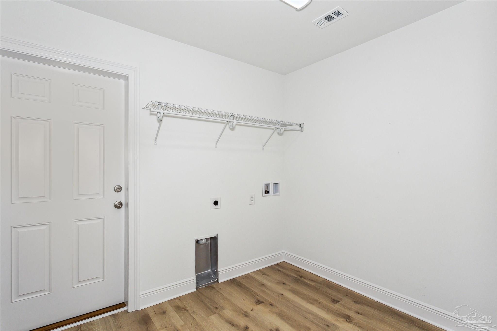 9319 Salter Road Pace, FL 32571 - Photo 14 of 32 a view of a room with wooden floor