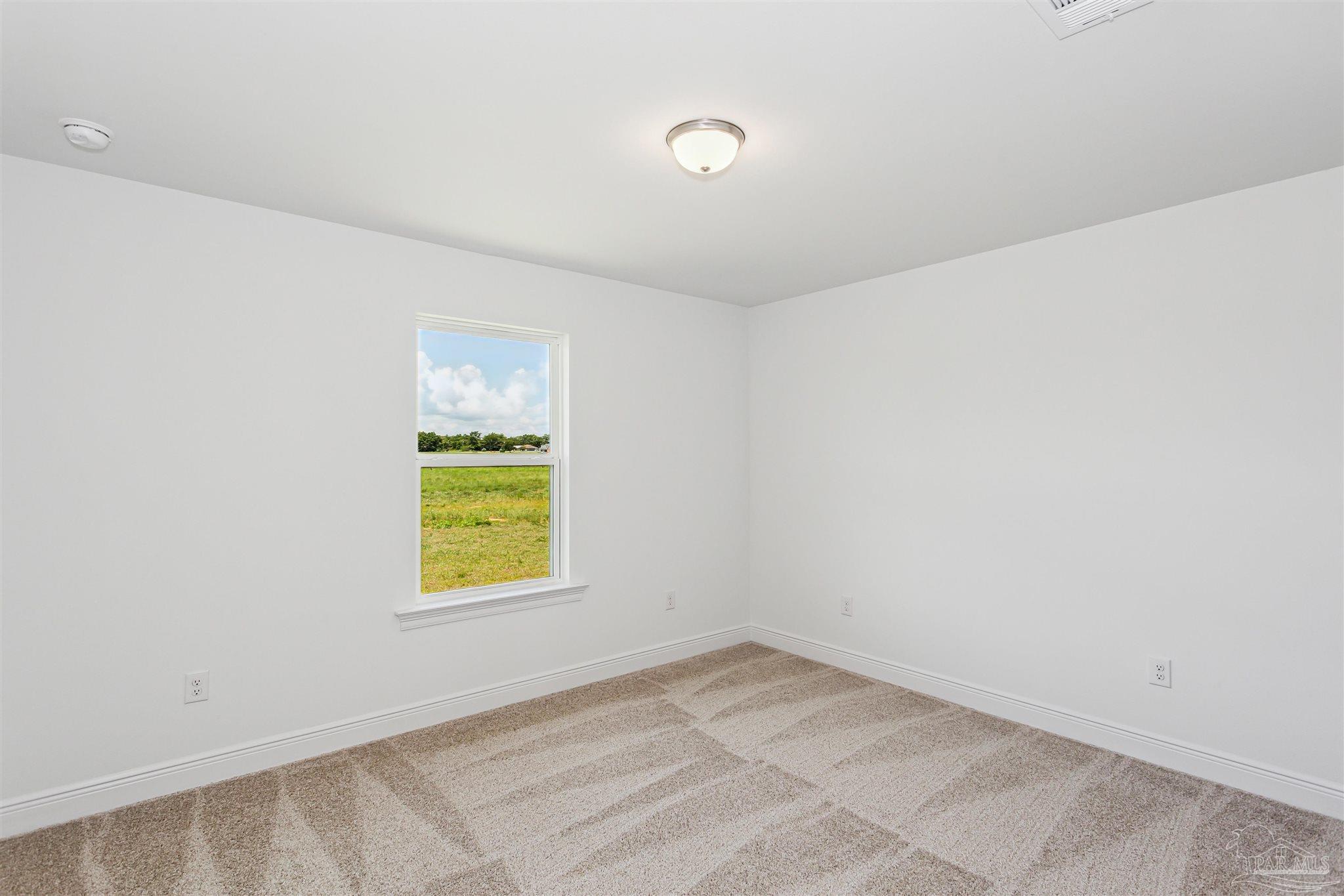 9319 Salter Road Pace, FL 32571 - Photo 17 of 32 an empty room with window