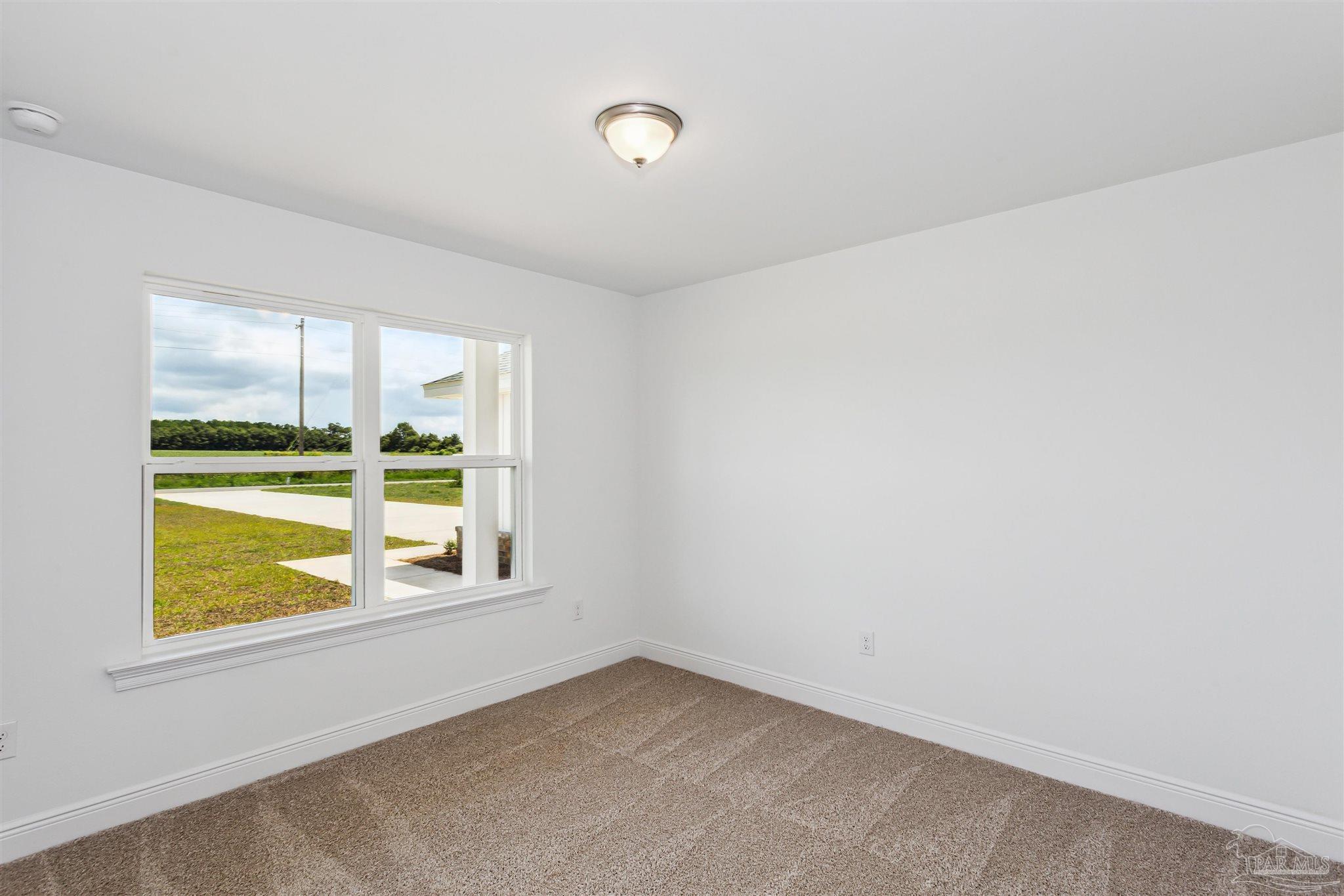 9319 Salter Road Pace, FL 32571 - Photo 19 of 32 an empty room with a window
