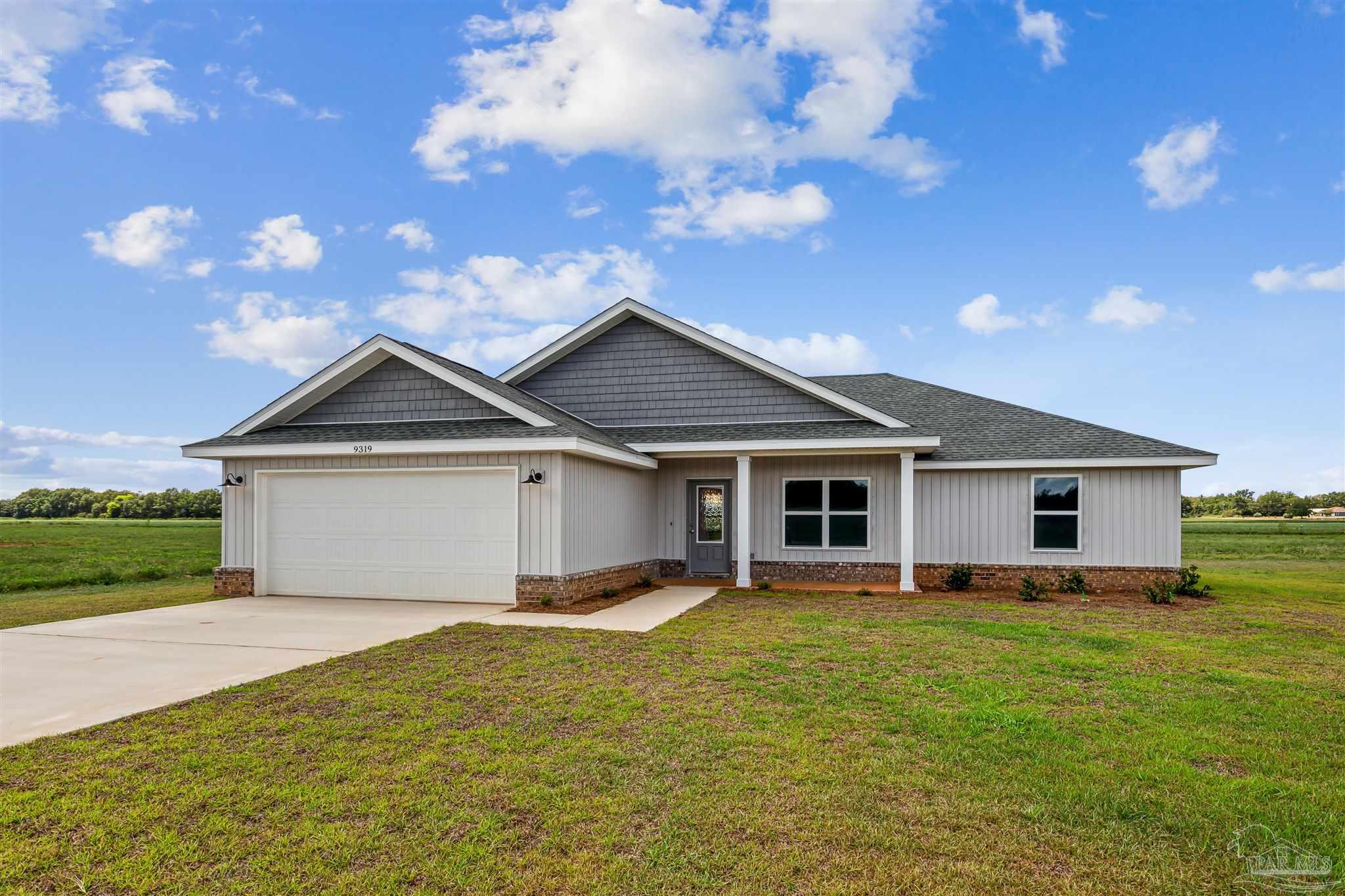 9319 Salter Road Pace, FL 32571 - Photo 2 of 32 a front view of house with yard and green space