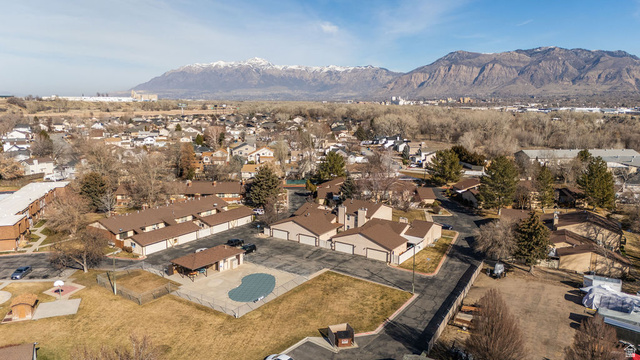 621 Coachman Way Riverdale, UT 84405 - Photo 33 of 38 Aerial view of property's location with a mountainous background and nearby suburban area