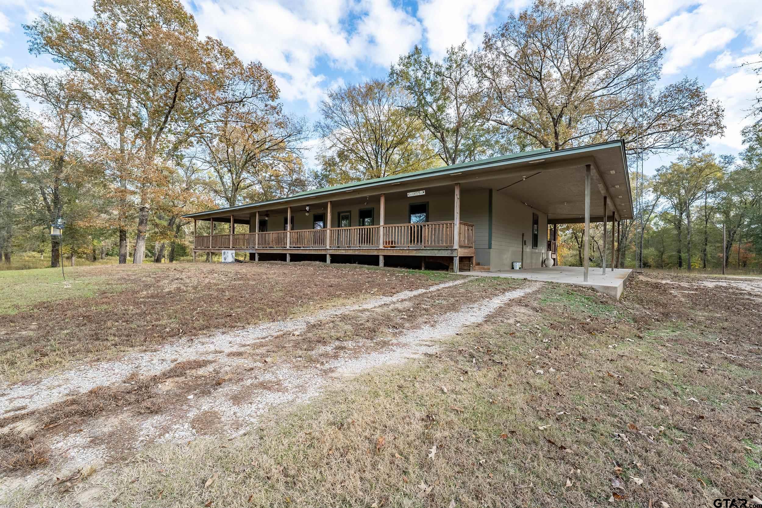 20304 State Highway 155 Winona, TX 75792 - Photo 17 of 48 a view of a house with a yard and trees