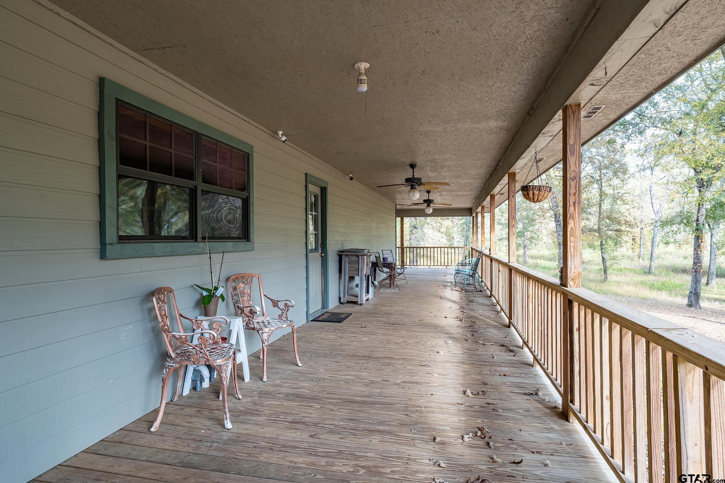 20304 State Highway 155 Winona, TX 75792 - Photo 18 of 48 a view of a porch with furniture and a yard