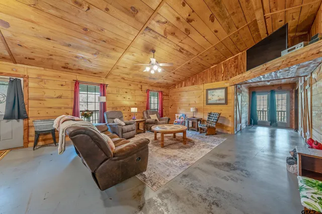 a living room with furniture and a outdoor space