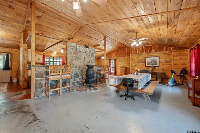 a dining room with furniture and wooden floor