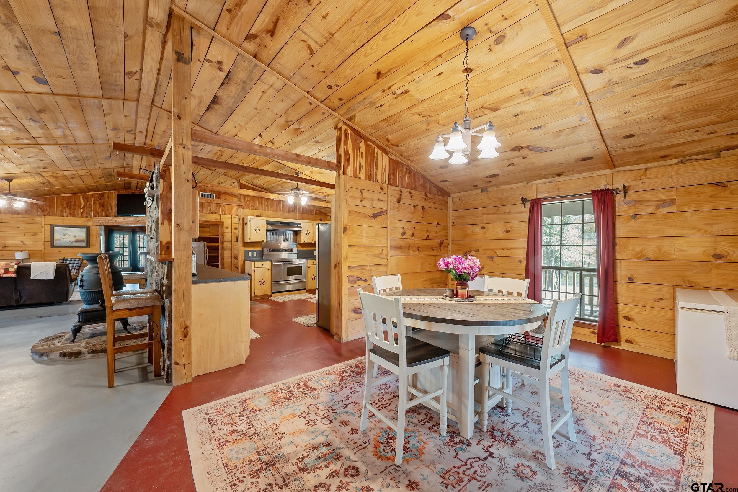 20304 State Highway 155 Winona, TX 75792 - Photo 24 of 48 a dining room with furniture and wooden floor