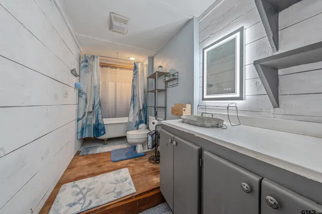 a bedroom with furniture and a chandelier