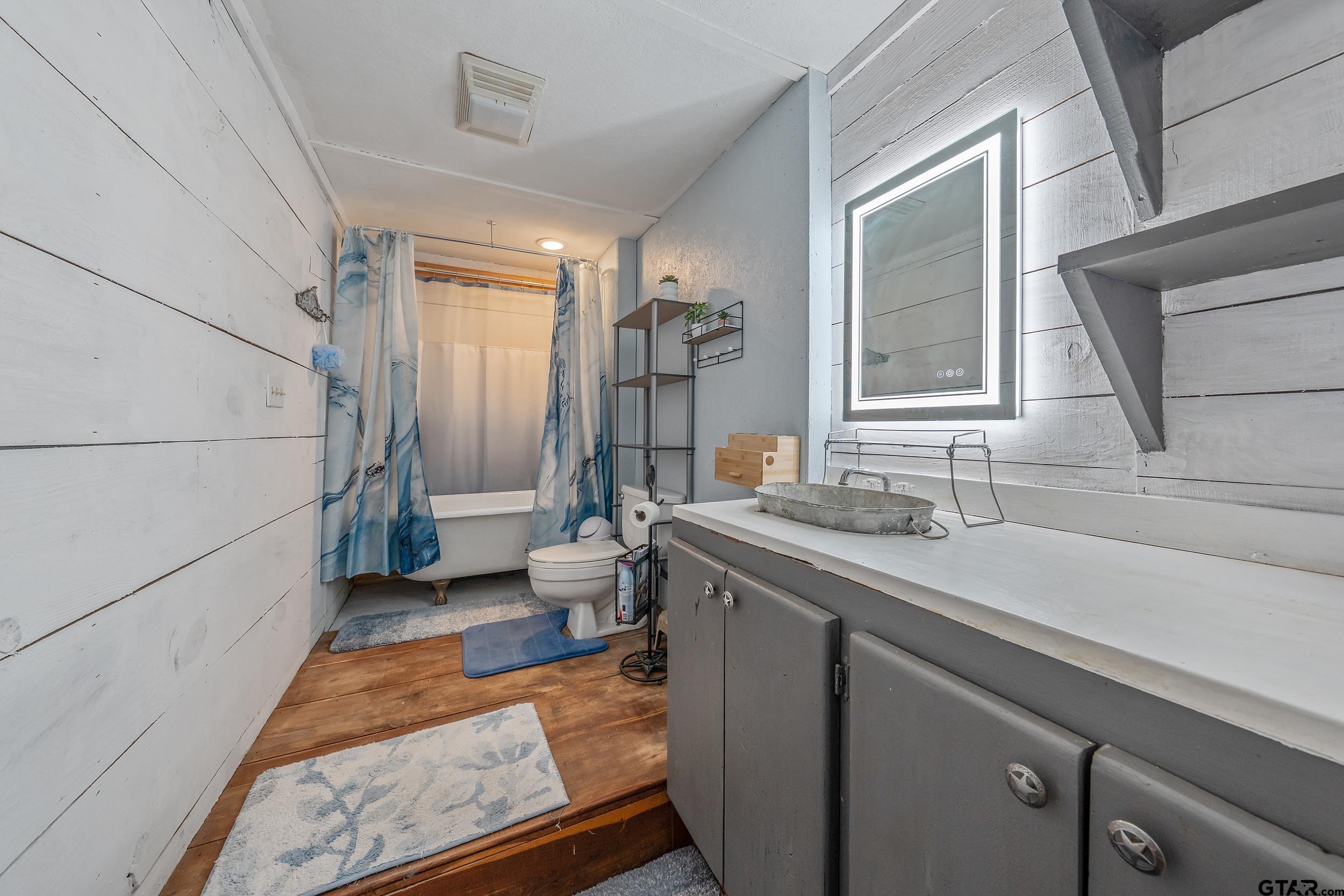 20304 State Highway 155 Winona, TX 75792 - Photo 30 of 48 a bathroom with a sink and a mirror