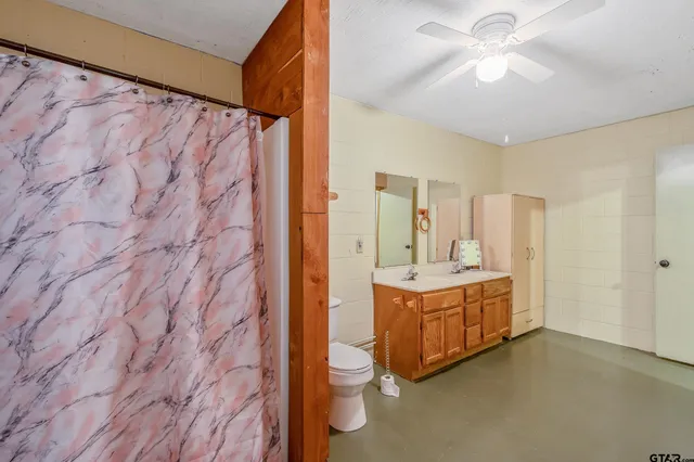 a bathroom with a shower and a toilet
