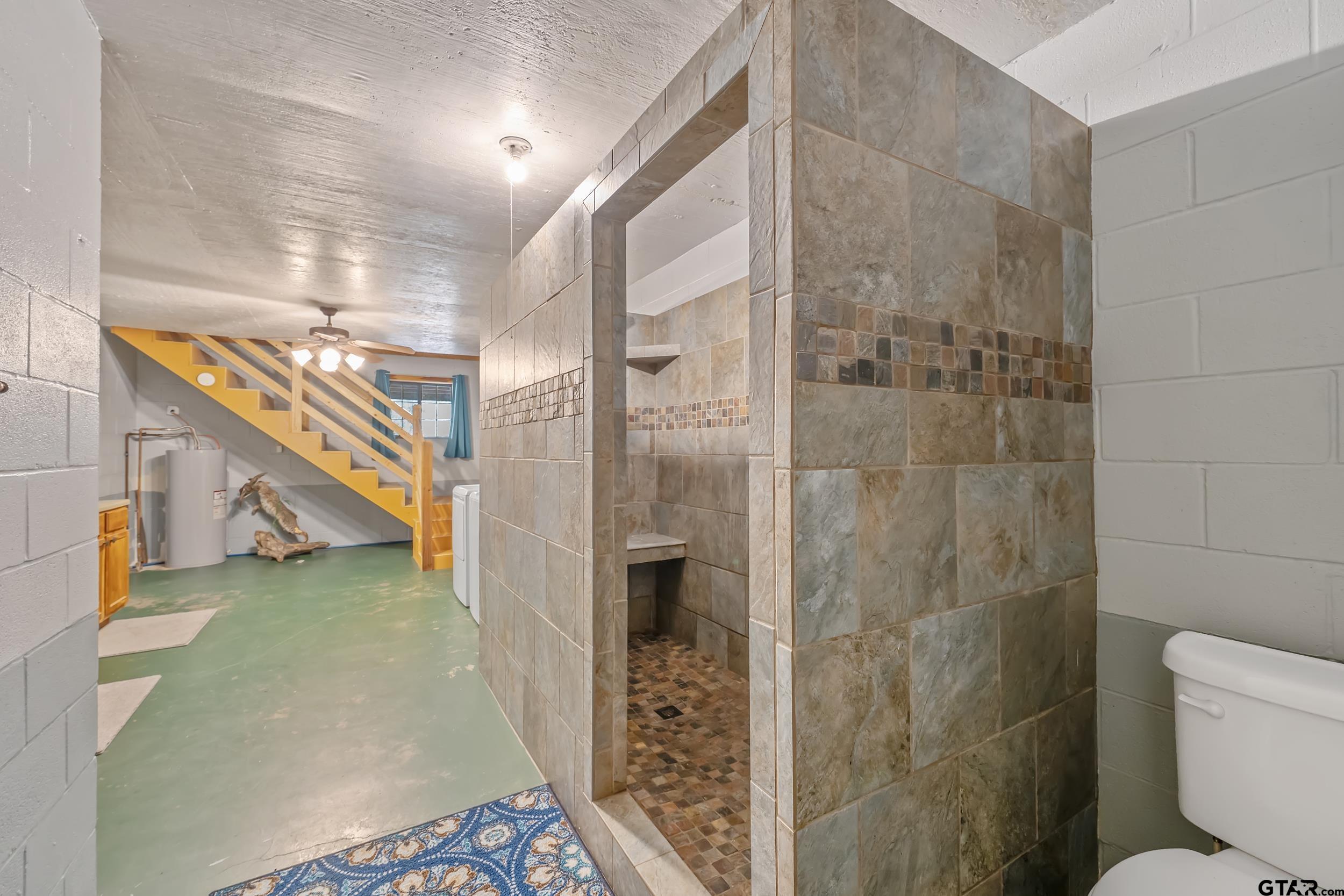 20304 State Highway 155 Winona, TX 75792 - Photo 37 of 48 a bathroom with a shower and a toilet