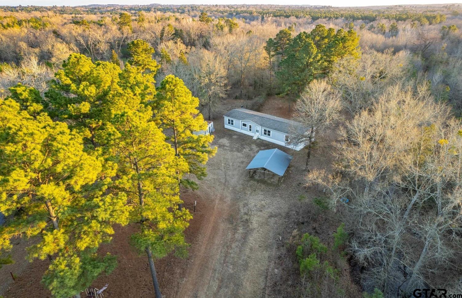 20304 State Highway 155 Winona, TX 75792 - Photo 44 of 48 an aerial view of residential house with swimming pool and lawn chairs