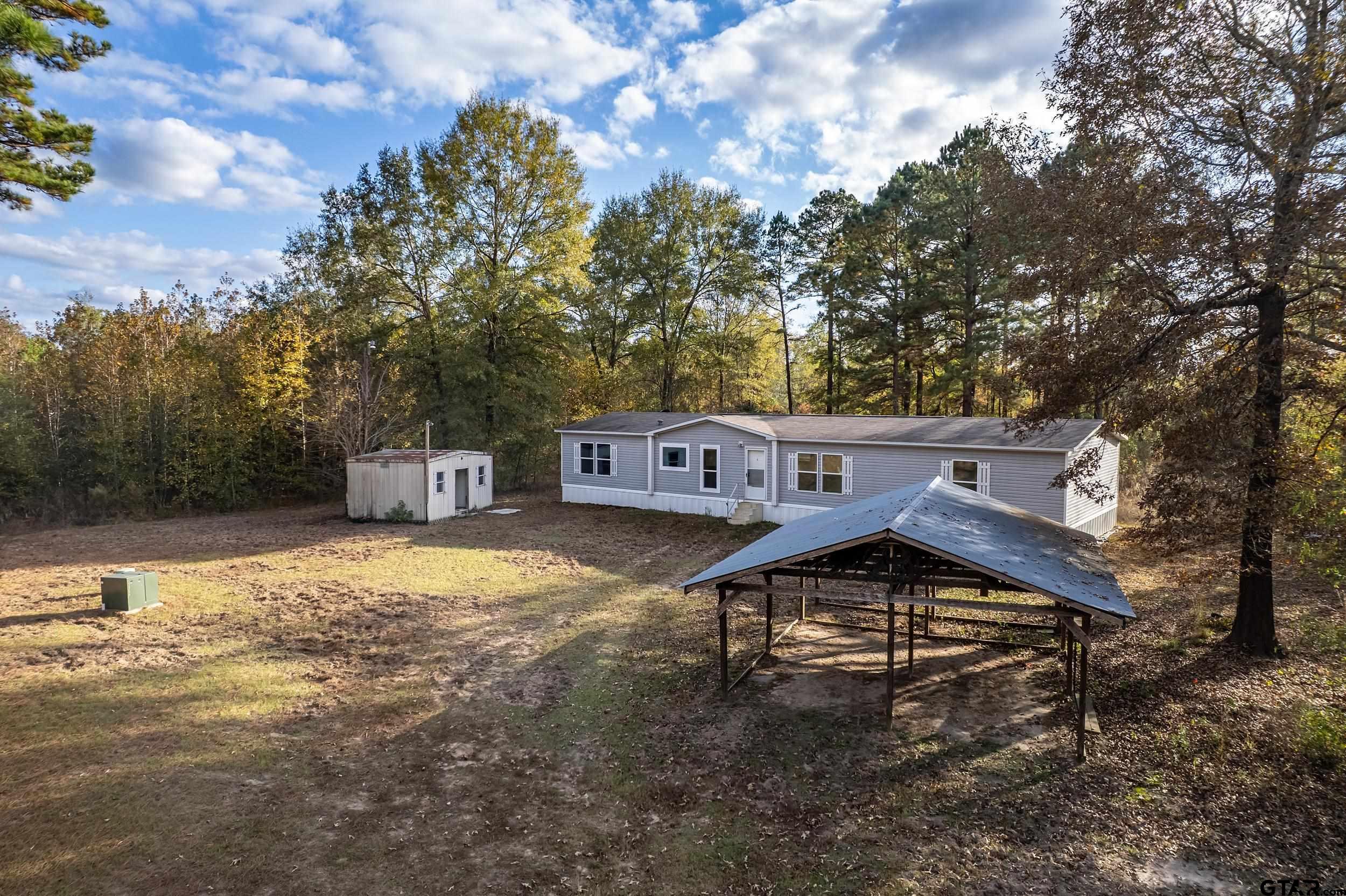 20304 State Highway 155 Winona, TX 75792 - Photo 45 of 48 a view of a house with a yard