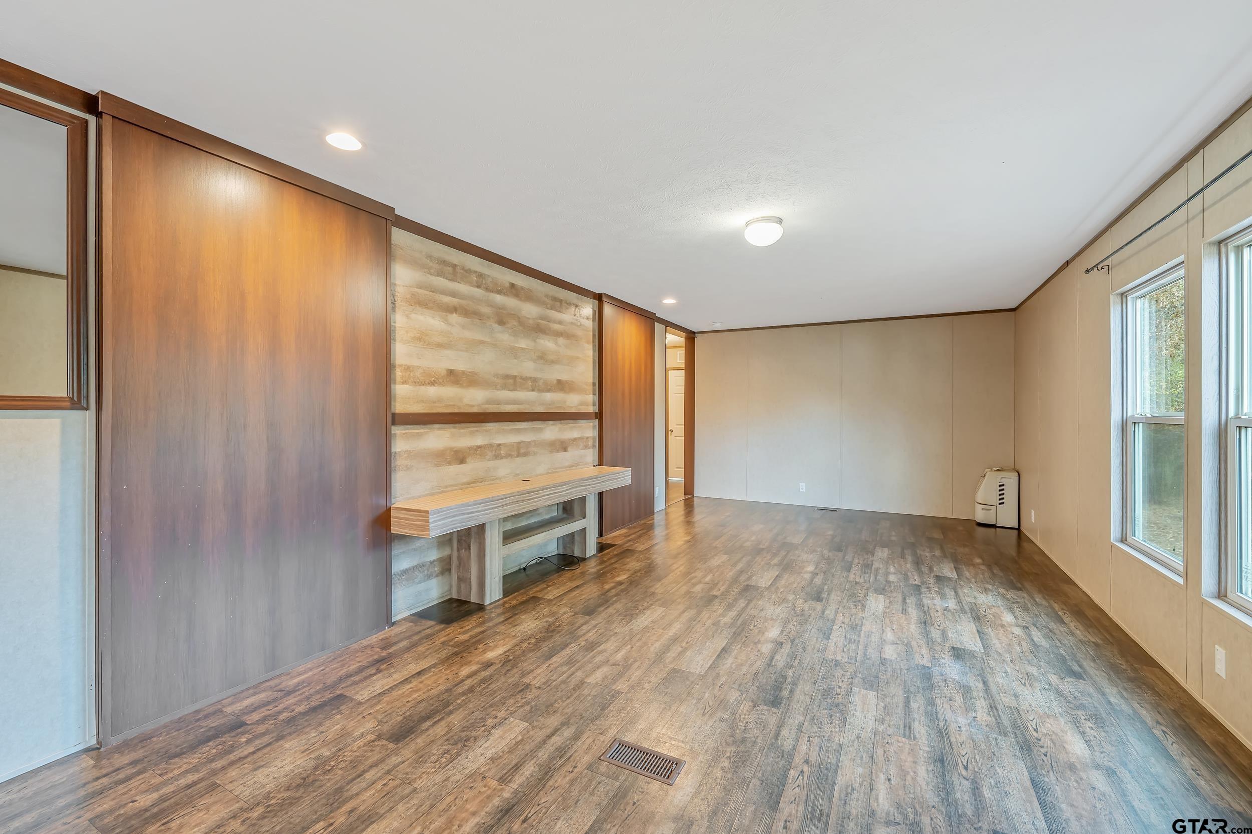 20304 State Highway 155 Winona, TX 75792 - Photo 46 of 48 an empty room with wooden floor and windows