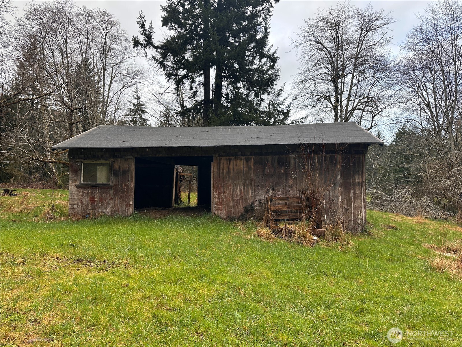 310 Butte Creek Road Raymond, WA 98577 - Photo 21 of 25 a view of a chair and table in backyard of the house