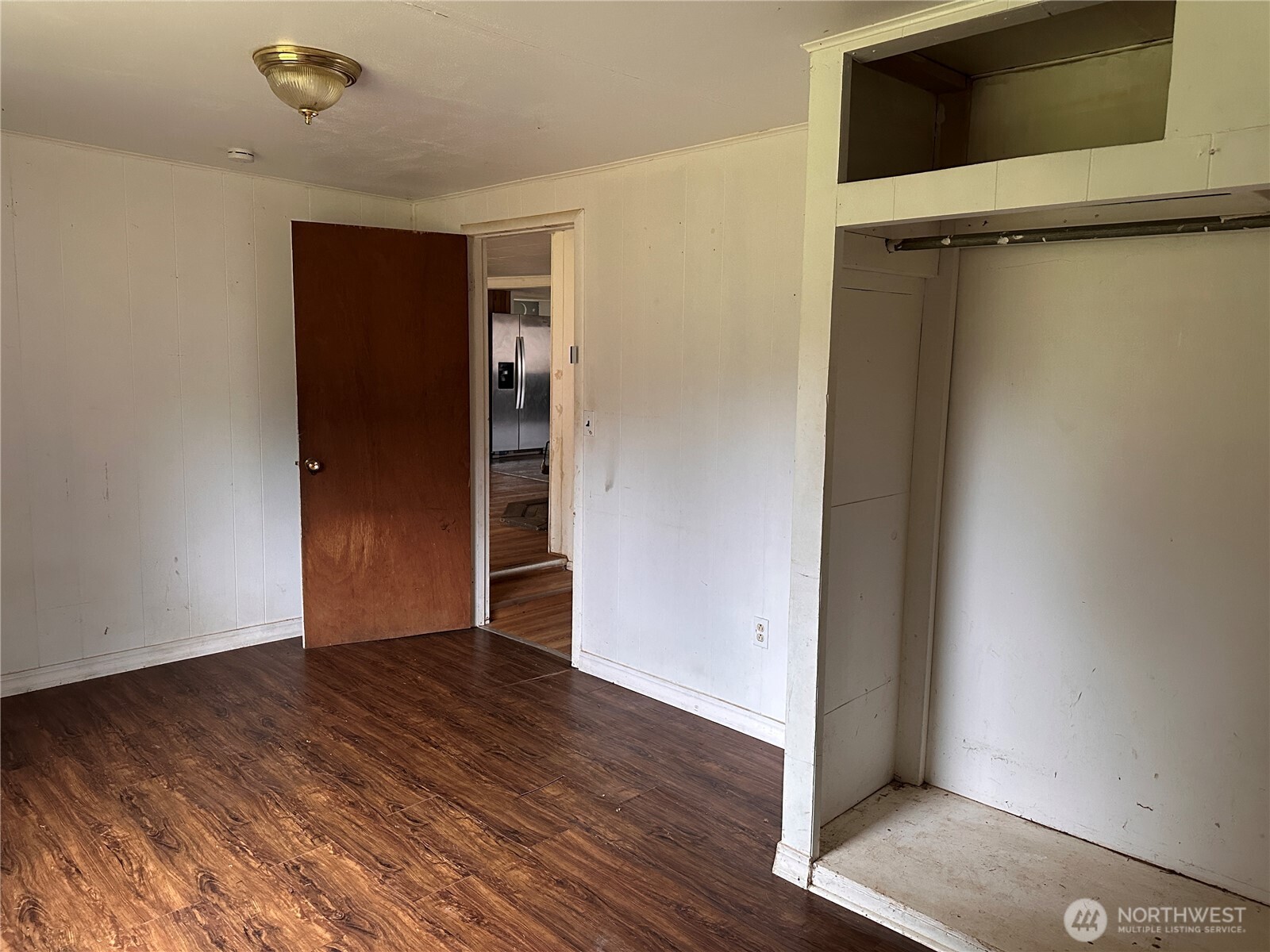 310 Butte Creek Road Raymond, WA 98577 - Photo 10 of 25 a view of an empty room with wooden floor and a window