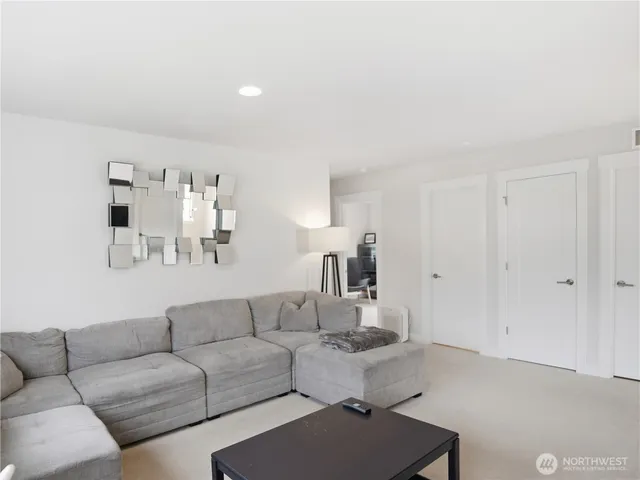 a living room with furniture and night stand