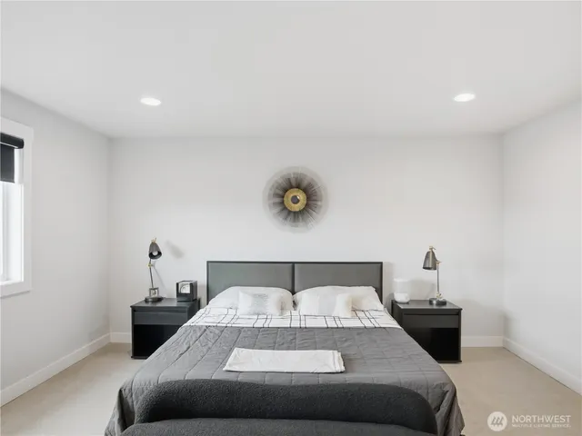 a bedroom with a bed and window