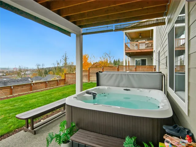 a view of a house with a yard and pathway